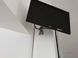 a flat screen tv mounted on the wall in the room