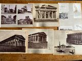 many old photos of a building on the table