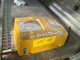 a yellow box sitting on top of a conveyor belt