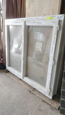 two windows that have been placed on the floor
