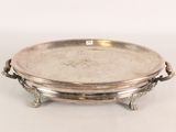 a silver tray with handles on a white surface
