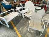 a lot of chairs and tables that are in a warehouse
