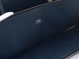 a close up of the inside of a blue leather bag