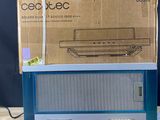 an old radio sitting on top of a wooden table next to a cardboard box