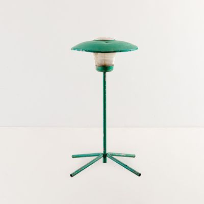 an image of a green table lamp on a tripod base