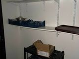 a black cart with boxes on it in a room