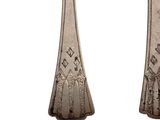 pair of antique silverware spoons on a white background