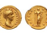 a gold coin with an image of a woman holding a staff