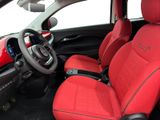 the interior of a car with red leather seats and a steering wheel