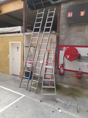 a ladder that is leaning against a wall in a garage