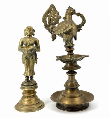 pair of antique brass figurines of a woman and a bird