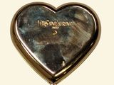 a silver heart shaped box with a message on it