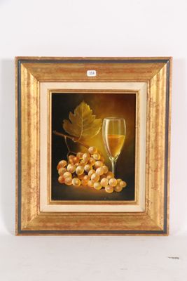 tableau représentant un verre de vin et des raisins posés sur une table