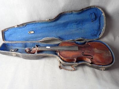 a violin in a blue case on a white surface