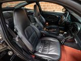 a picture of a car with leather seats and a steering wheel