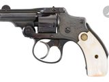 a close up of a revolver on a white background