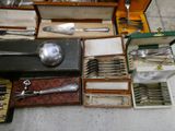 many different types of silverware in this case