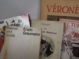 many books that are sitting on top of a table