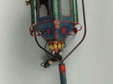 a small toy lamp that is attached to a pole