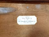 a close up of a label on a piece of wood