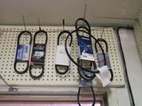 a wall with a bunch of electrical equipment hanging on it
