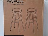 cardboard box of a pair of stools sitting on top of a table
