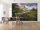 a dining room with a table and chairs and a large painting on the wall