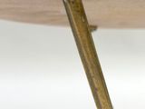 a close up of a wooden table with a metal handle