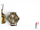 an image of a watch and a necklace on a white surface