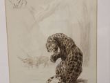 painting of a leopard and a bird in a frame on a table