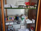 a glass display case with various items in it