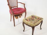 two chairs and a foot stool on a white surface
