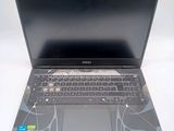 a laptop computer with a black keyboard on a white surface