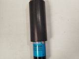 a close up of a black cylinder on a white surface