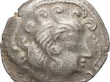 une pièce de monnaie en argent portant l'image d'un visage d'homme