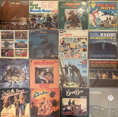 a lot of records on the wall of a room
