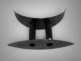 a close up of a black object on a white background