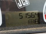 a close up of a gas pump with a clock on it