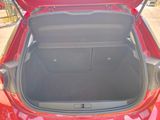 a trunk of a red car with its doors open