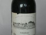 a bottle of wine that is sitting on a table