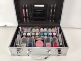 a silver case with a lot of makeup in it
