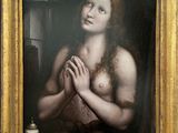 an oil painting of a woman holding her hands in front of her chest