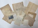 a pile of old letters and papers on a table
