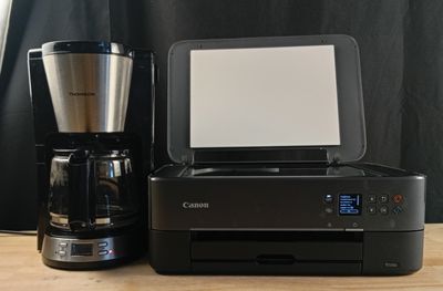 a coffee maker and a coffee maker on a table