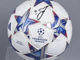 a soccer ball with the name of the champions league written on it