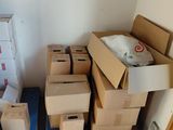 many boxes stacked on top of each other in a room