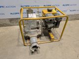 a close up of a pump on a cart in front of a wall