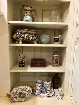 a cabinet with a lot of items on top of it