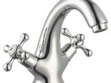 a faucet that has a cross handle on the faucet