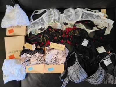 a lot of bras that are sitting on a couch